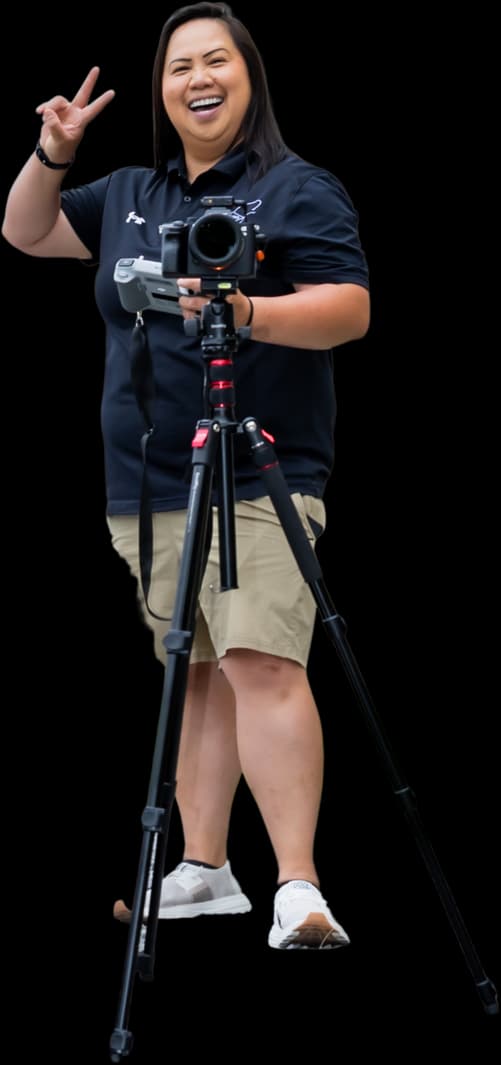 Cheris Chanthavong, owner of CS Media, with her camera and tripod
