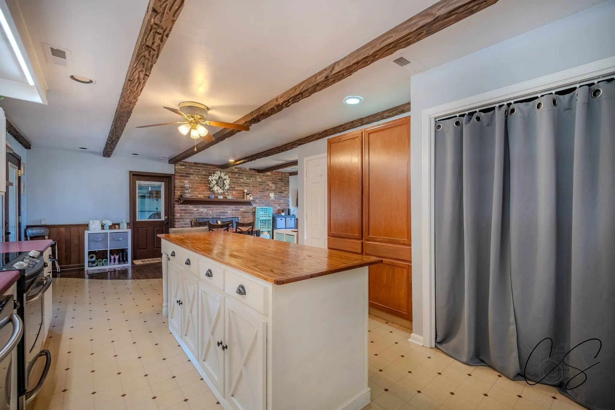 Professional real estate photography of a rustic kitchen with wood beams in Kentucky
